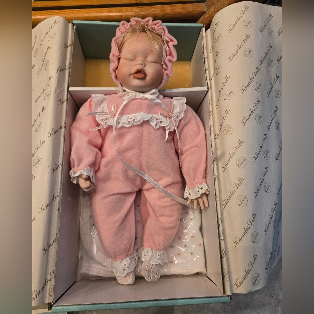 Pretty porcelain doll with certificate of authenticity. Never taken out of box.
